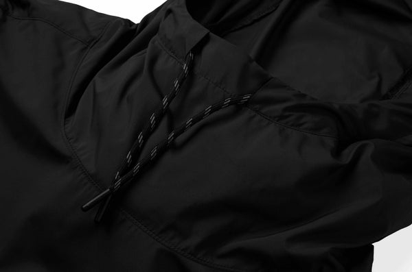 Chrome industries unisex, black windproof rain jacket with a hood. Built from super soft, windproof this Buckman packable anorak is an ideal companion for windy rides and autumn scooter sessions.